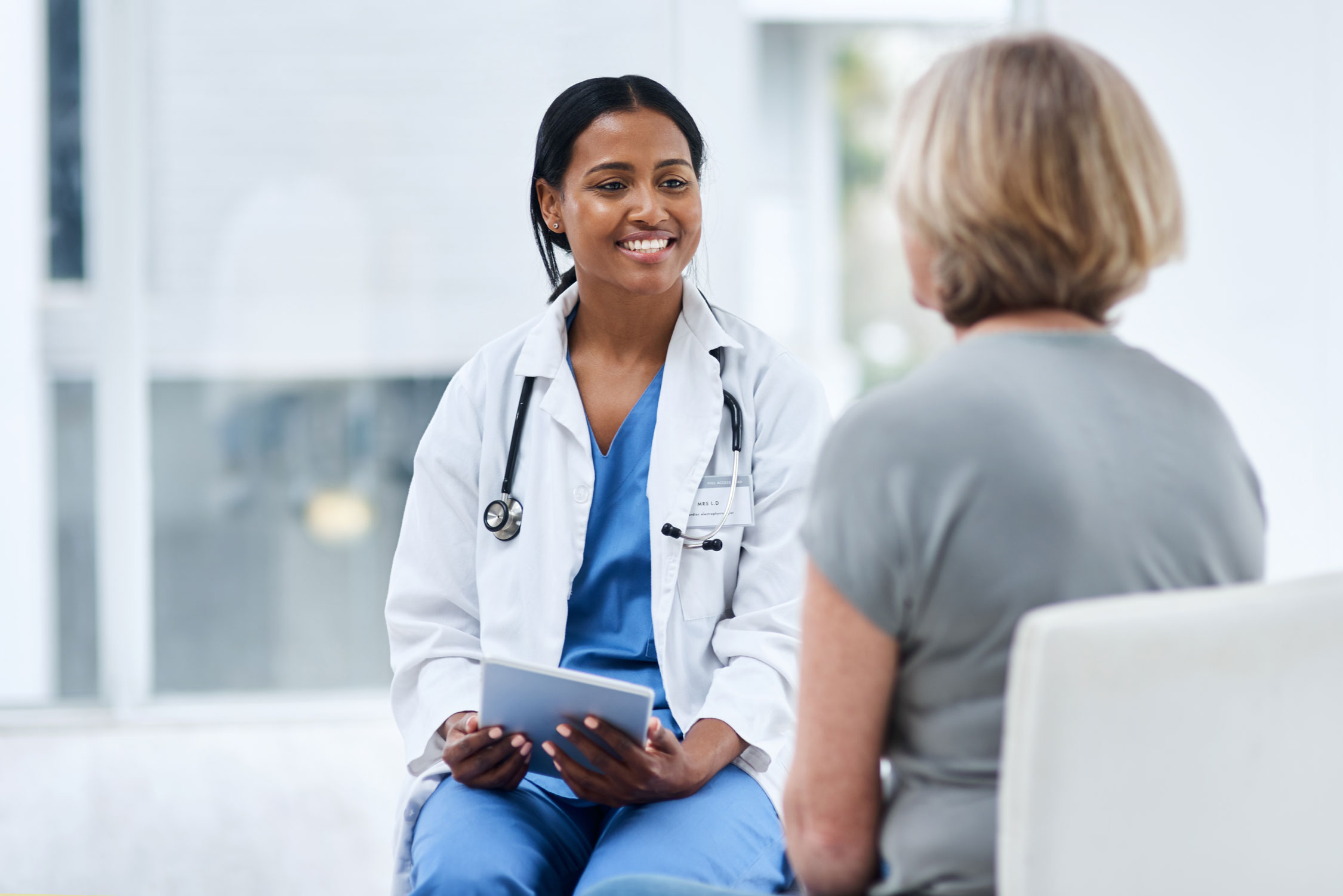 Altus physician consulting with a patient